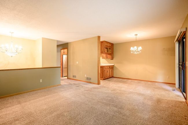 Spacious and open floor plan offering convenient access to the living, dining, and kitchen areas. | Image 6