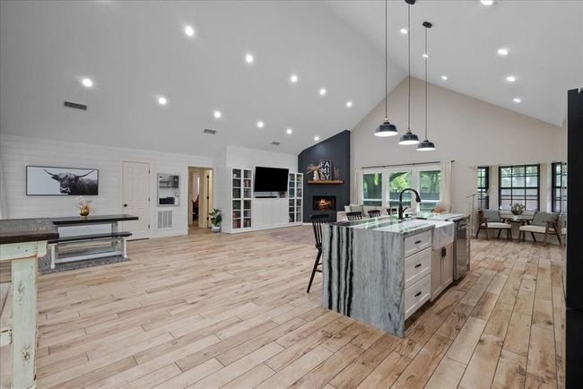 Grand open layout showcasing the living, kitchen, and breakfast nook in harmony. | Image 20