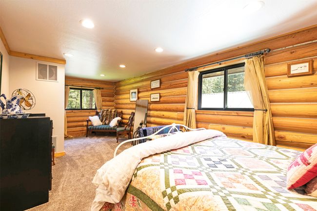 upstairs bedroom featuring recessed lighting and log walls | Image 26
