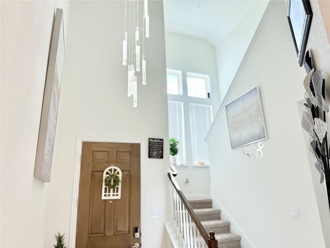 Entrance foyer with a high ceiling and stairs | Image 16