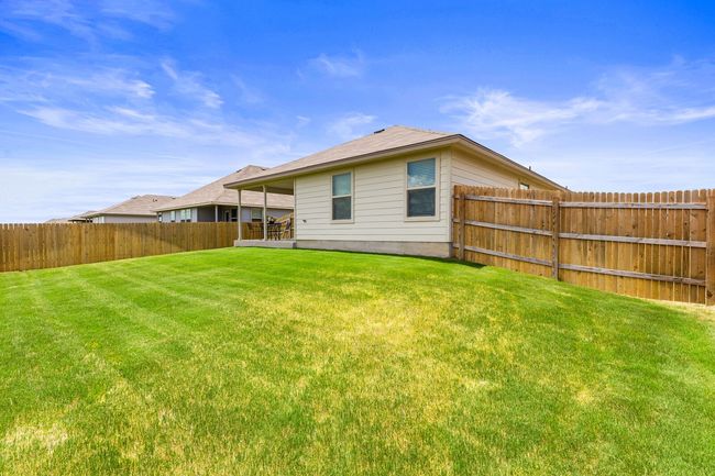 Back of property featuring a fenced backyard | Image 36
