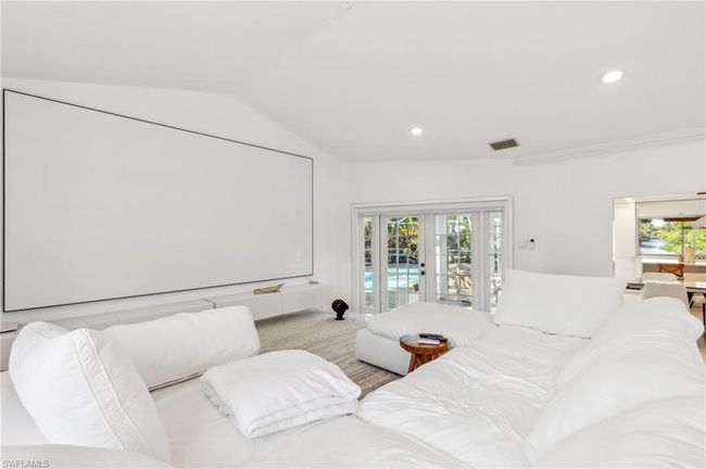 Cinema with vaulted ceiling, french doors, recessed lighting, and visible vents | Image 15