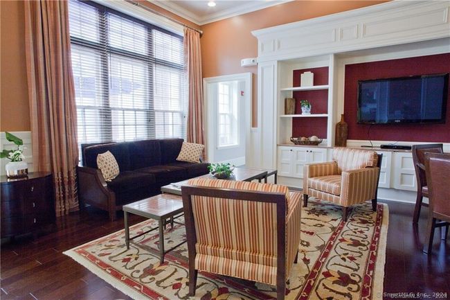 Game/TV room off the main lobby. | Image 19