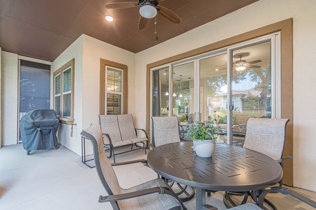 View of patio featuring a ceiling fan and a grill | Image 33