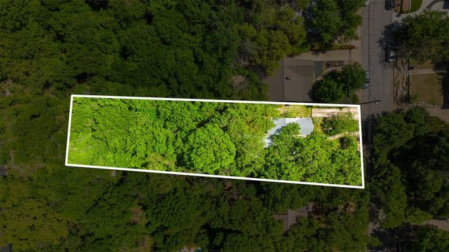 Aerial view of property's location with a forest and property boundaries highlighted | Image 31