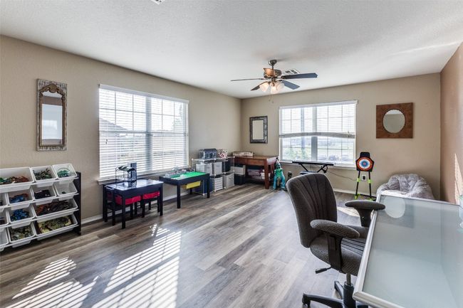 Office area with a ceiling fan, wood finished floors, and baseboards | Image 19