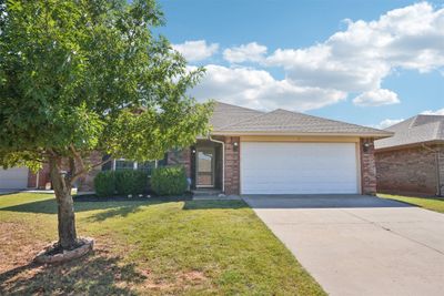 View of front of house featuring a garage and a front yard | Image 3