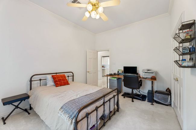 Bedroom featuring crown molding, ceiling fan | Image 21