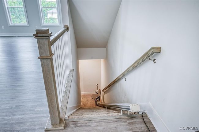 Stairs with wood finished floors and baseboards | Image 25