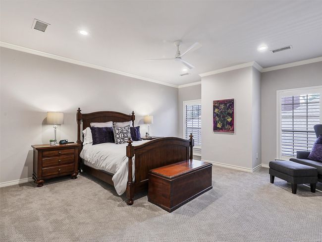Carpeted bedroom with recessed lighting, crown molding, and a ceiling fan | Image 28