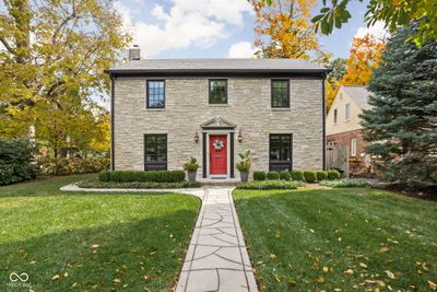 Located in sought after Forest Hills! Discover the epitome of understated elegance in this stunning limestone Meridian Kessler home, where timeless charm meets modern sophistication. | Image 1