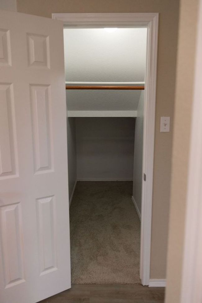 View of deep storage closet downstairs | Image 29