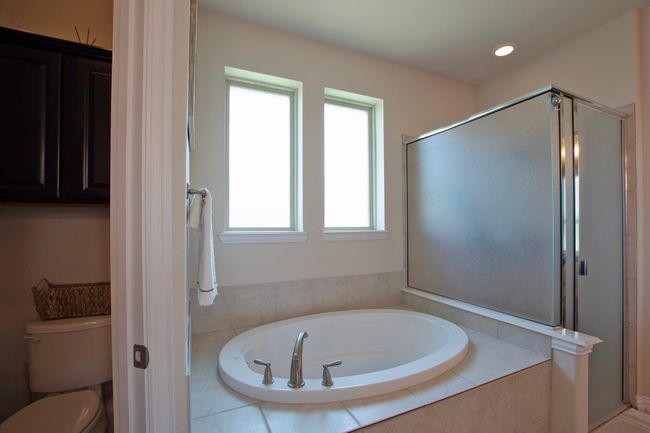 Full bathroom with recessed lighting, a stall shower, toilet, and a bath | Image 21