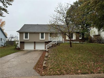 View of front with 2 Car garage and a front yard | Image 1