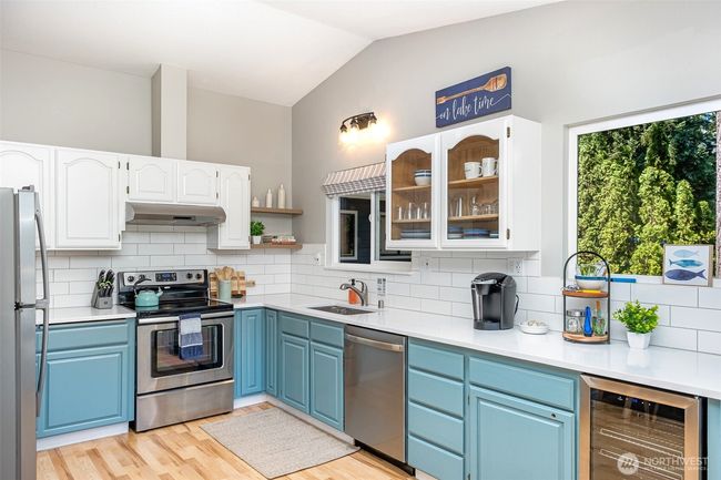 Kitchen with stainless appliances, quartz, subway tile | Image 19