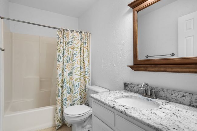 The guest bath has updated counters. | Image 31