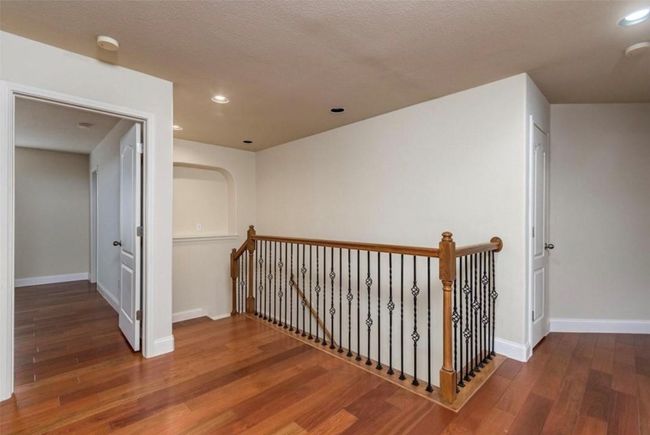 Hallway featuring an upstairs landing, hardwood / wood-style floors, baseboards, and recessed lighting | Image 19
