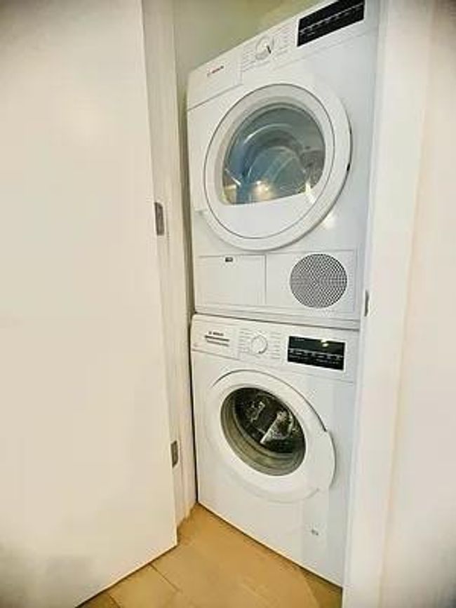 Clothes washing area with stacked washer / dryer | Image 17