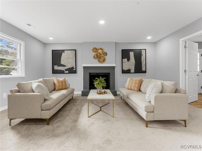 Living room with recessed lighting, visible vents, and a fireplace | Image 11