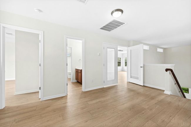 Empty room with light wood-type flooring | Image 24