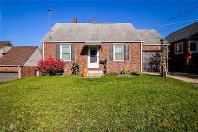 View of front of home featuring a front yard | Image 1