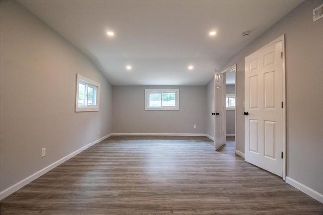 Unfurnished room with wood-type flooring and plenty of natural light | Image 9