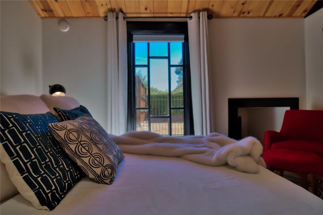 Bedroom featuring wood ceiling | Image 6