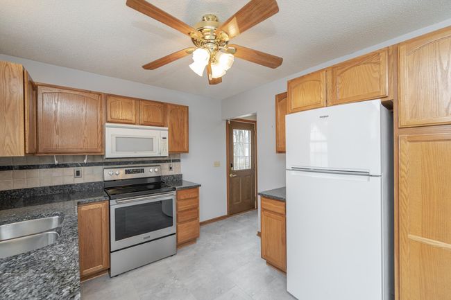 Pantry cabinet for great storage and side door off of the driveway | Image 11