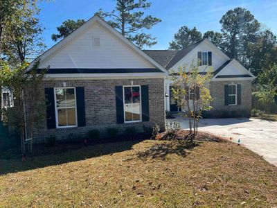 View of front facade with a front yard | Image 2