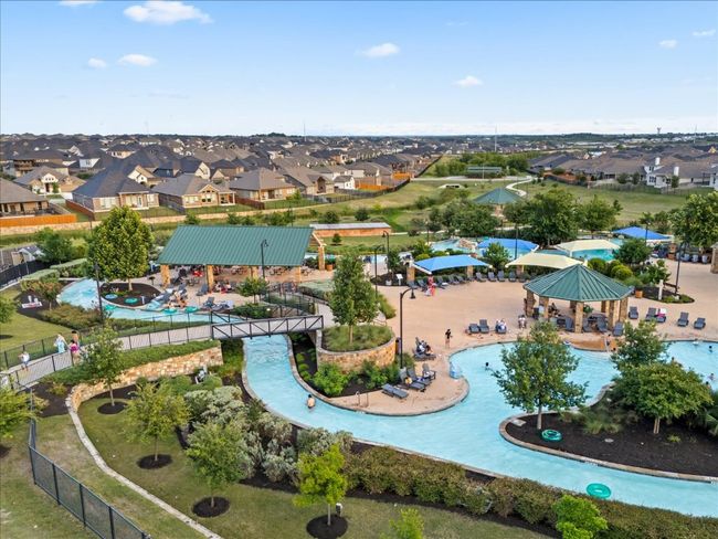 Aerial perspective of lazy river. This community has two lazy river areas, seperate third pool area, parks, and amenities center. | Image 37