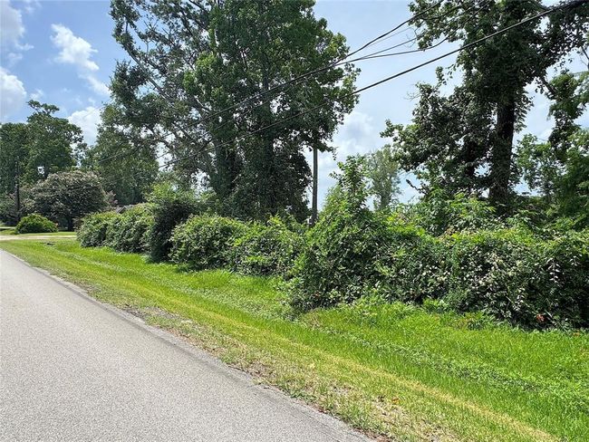 Another view of extra lot on right side of home that can be purchased separately. | Image 19