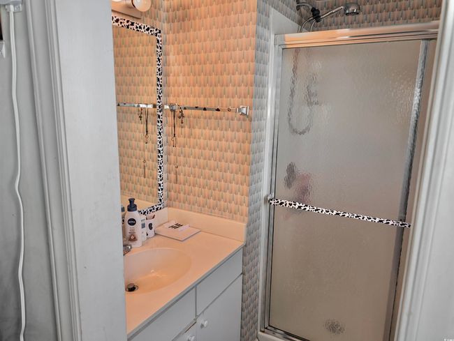 Bathroom featuring vanity and an enclosed shower | Image 11
