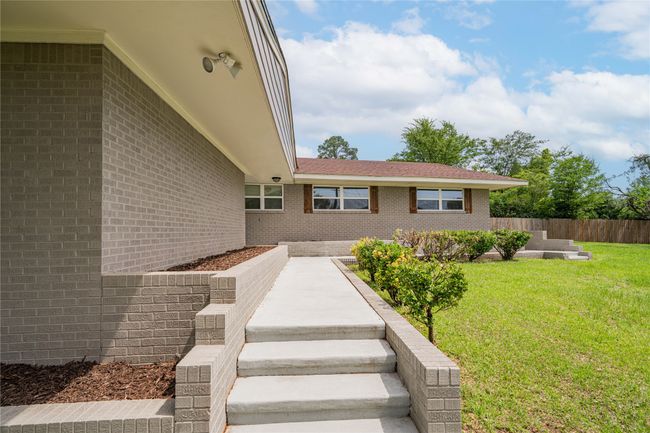 Entrance to property featuring brick siding | Image 30