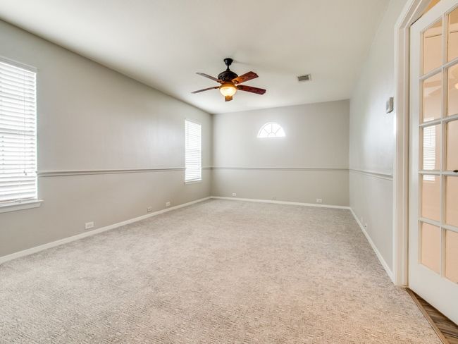 Carpeted spare room with a ceiling fan and baseboards | Image 10