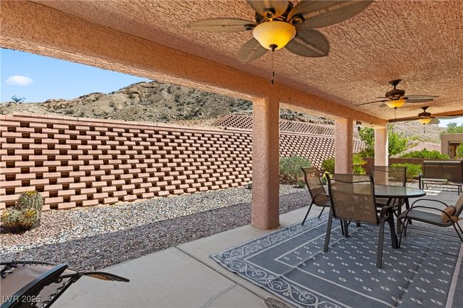 View of patio / terrace with outdoor dining space and ceiling fan | Image 40