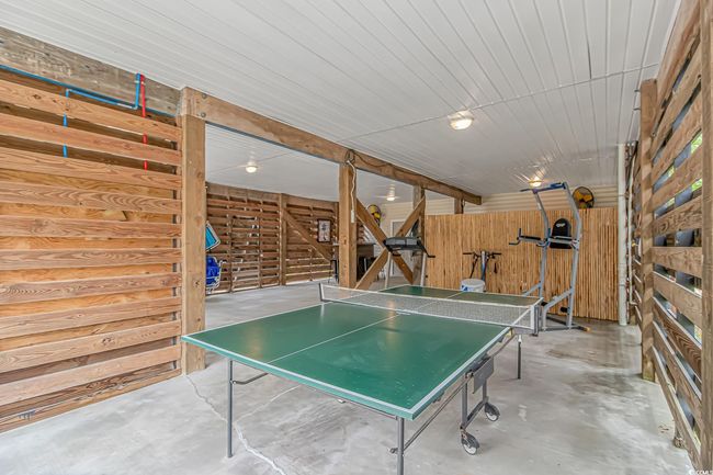 Recreation room featuring unfinished concrete floors | Image 27