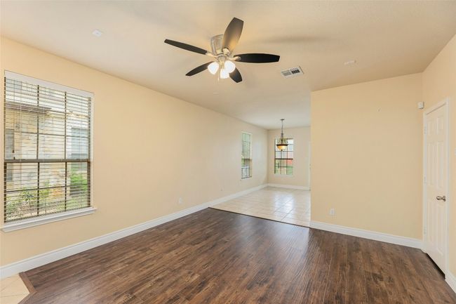 Empty room featuring wood finished floors and ceiling fan | Image 4