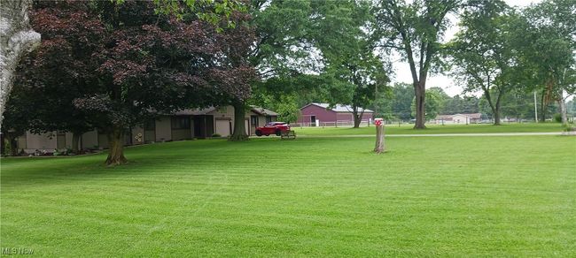 View of home's community with a yard | Image 29