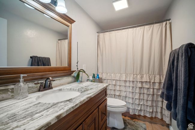 Bathroom with tile patterned floors, toilet, and vanity | Image 10