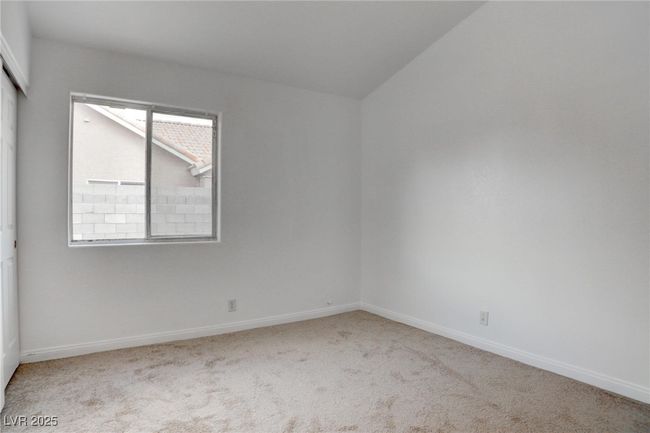 Bedroom with lofted ceiling, & a closet | Image 30
