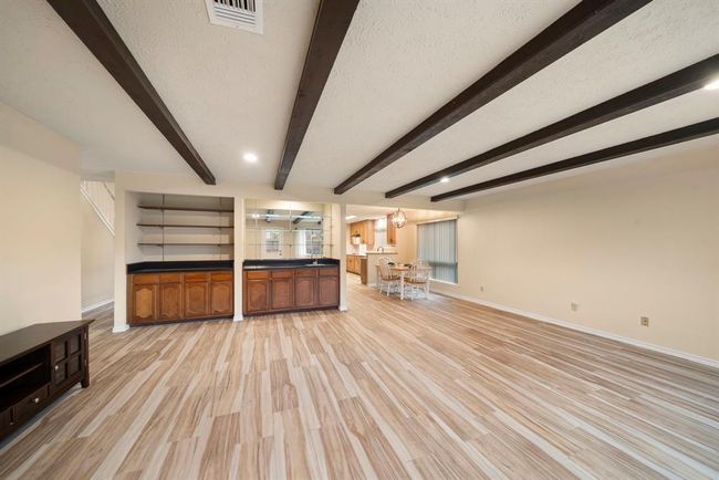 The open layout provides seamless flow to the breakfast area and kitchen, creating a functional space suited to entertaining or everyday living. | Image 15