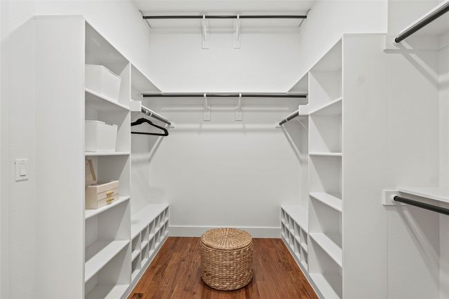 Walk in closet with wood finished floors | Image 17