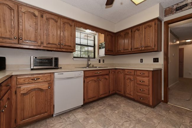 Kitchen window overlooks front yard | Image 16