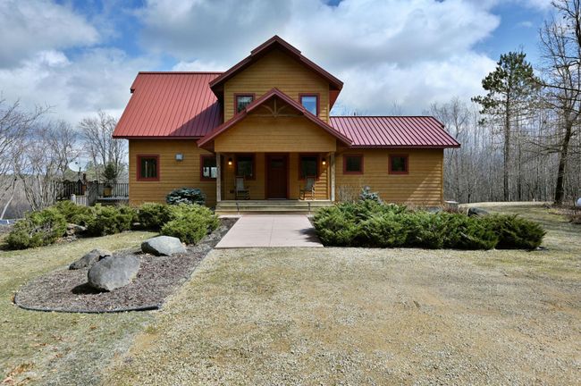 A wide sidewalk leads to the front door. | Image 57