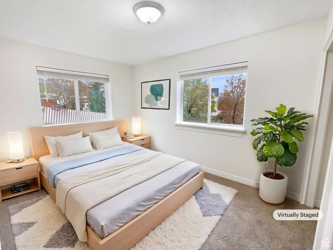 Carpeted bedroom featuring baseboards | Image 4