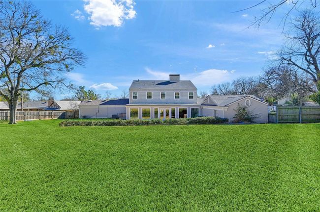 Rear view of property featuring a chimney | Image 33