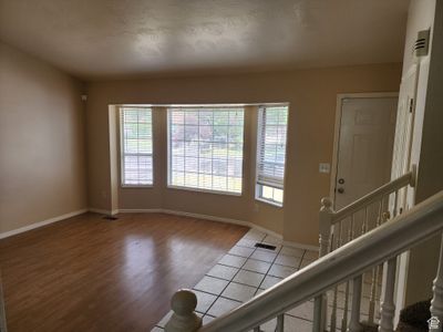 Entrance foyer/ Family Room with laminate wood Floor | Image 3