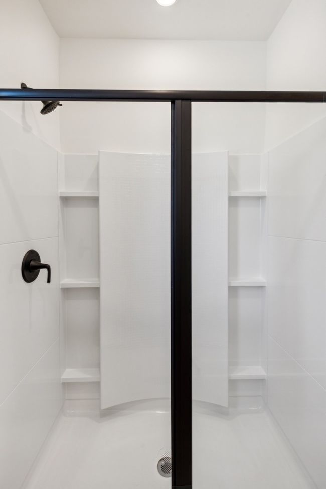 A shower big enough to accommodate storage for all your bottles! Actual photo of home. | Image 23