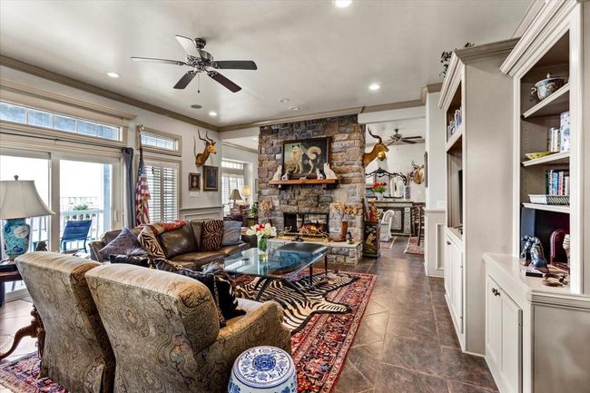 The fusion of Ralph Lauren’s English Carriage home-inspired stone walls with the rich wood paneling and trim reminiscent of the Tremont Hotel establishes an atmosphere of timeless sophistication and warmth. | Image 9