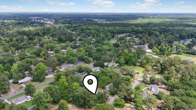 Aerial view of residential area featuring a forest | Image 37